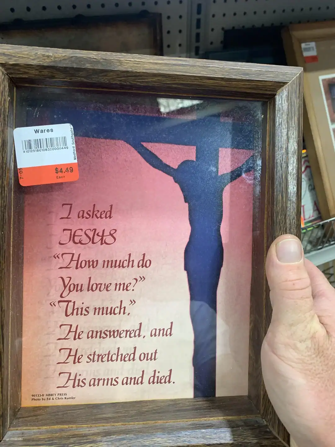 Religious shadow art of Jesus on the cross in a wooden frame.