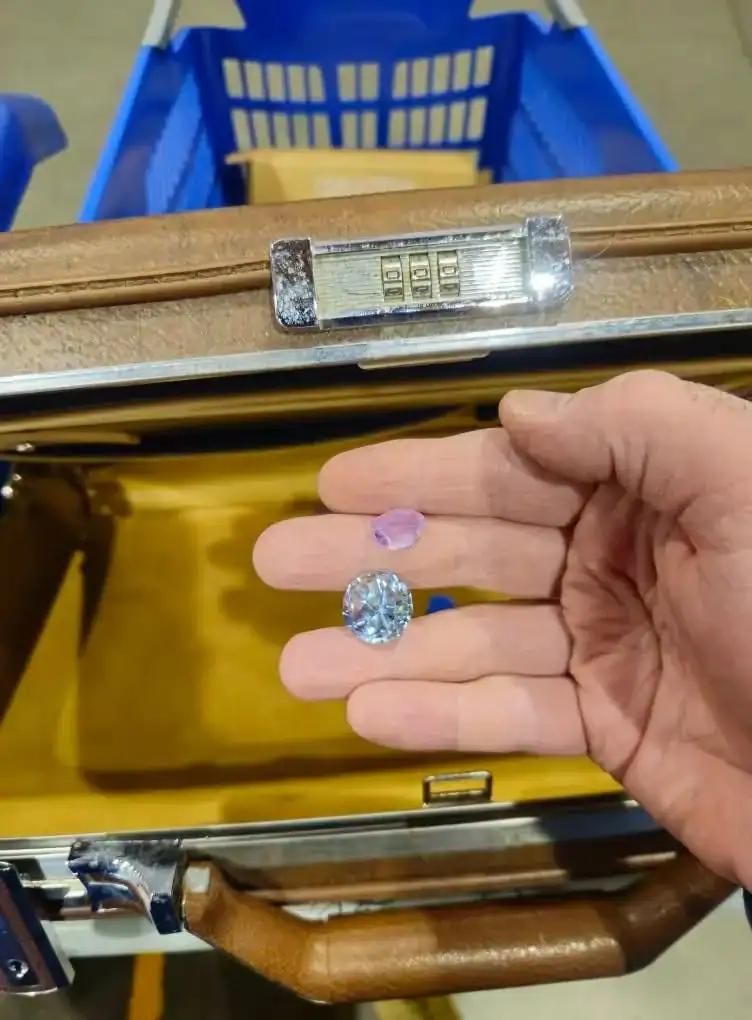 Thrift store jewelry with diamond and purple gemstone, unique vintage accessories.