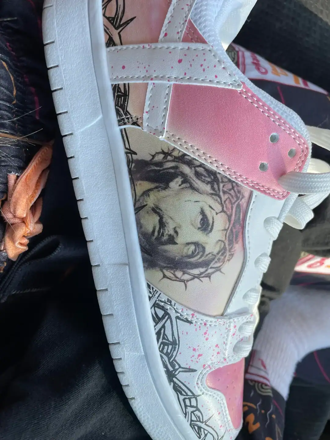 Custom sneakers with a portrait of a woman and artistic design.