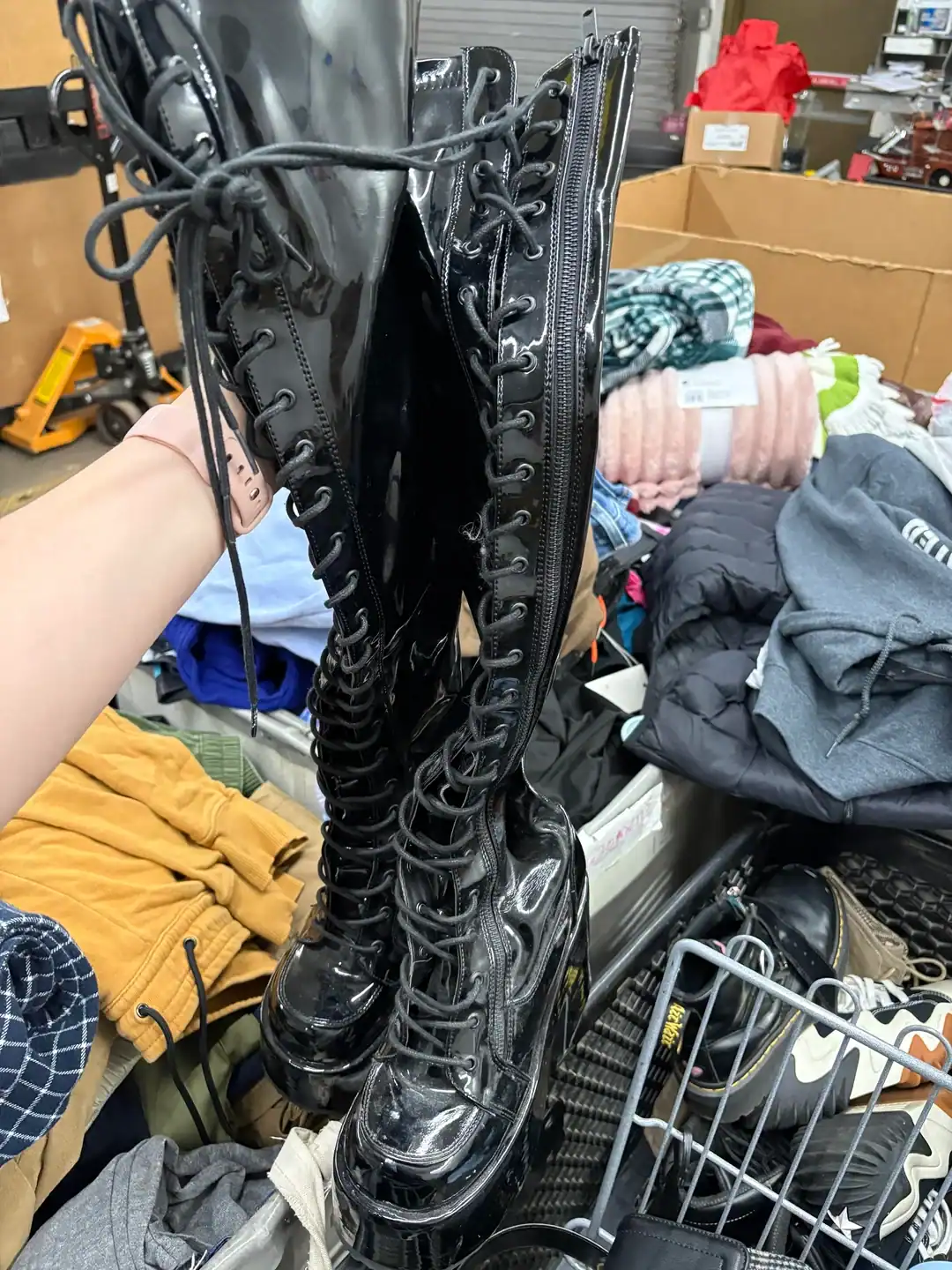Vintage black combat boots with laces and zipper, perfect for alternative fashion styles.