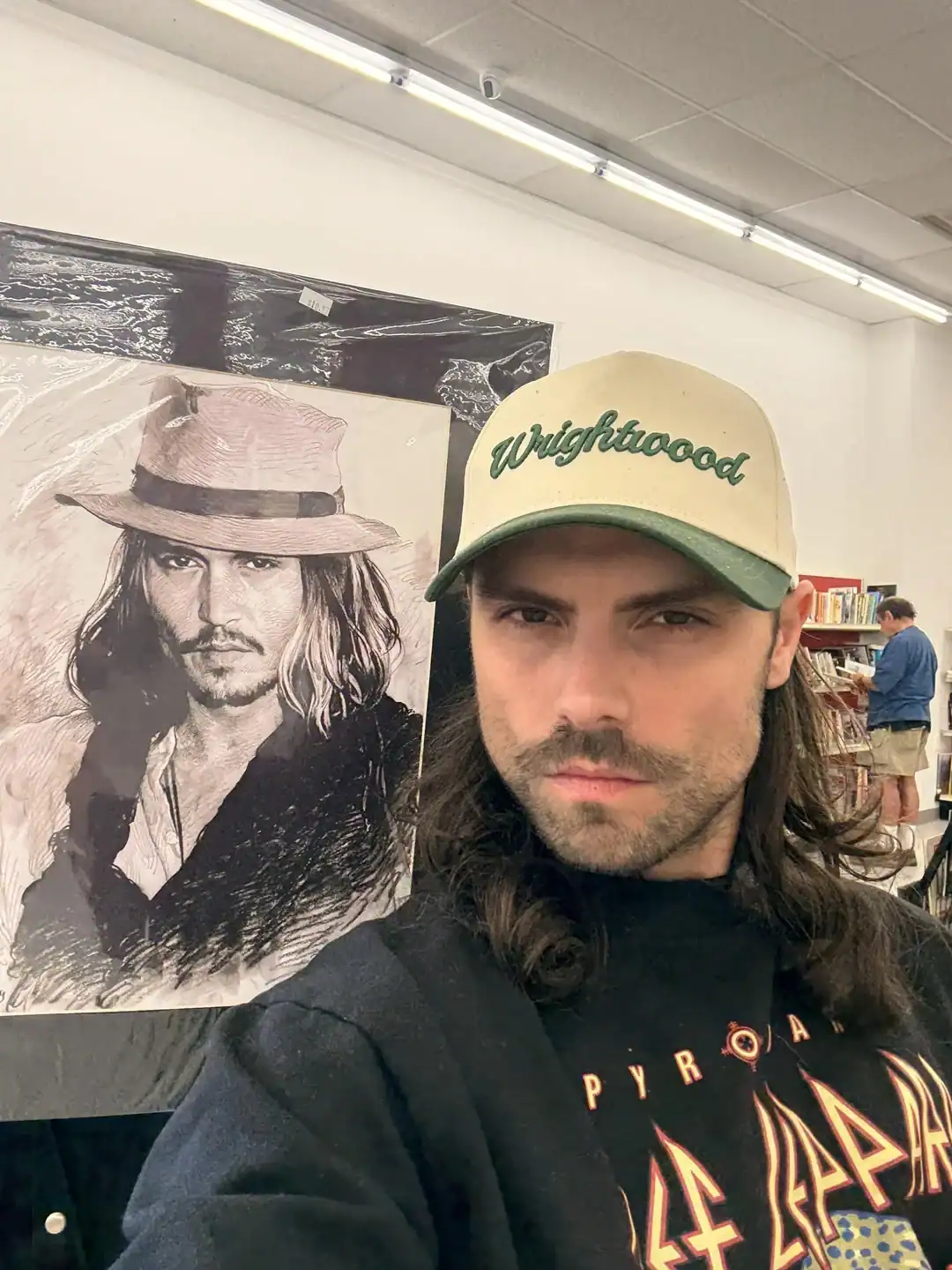 Vintage Johnny Depp poster with hat at thrift store.