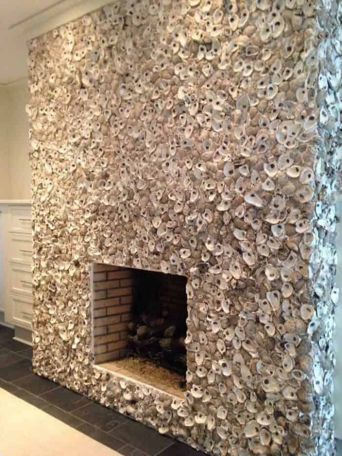 Shell-covered fireplace wall for a rustic, natural look.