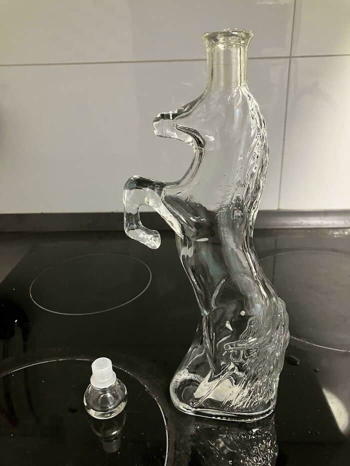 Glass seahorse sculpture on kitchen countertop.