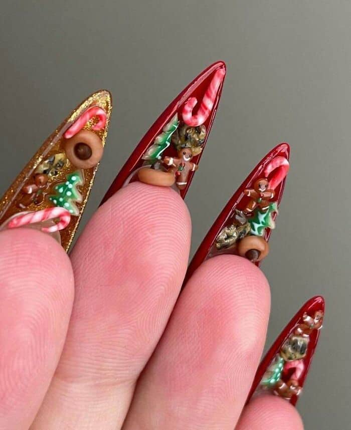 Festive Christmas nail art with holiday-themed decorations and bright colors.