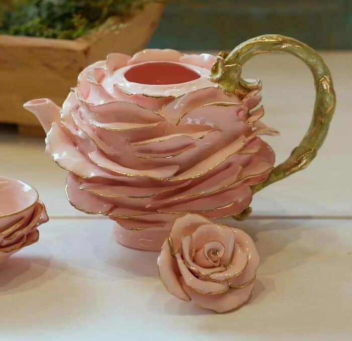 Pink rose-shaped ceramic teapot with gold accents and matching rose cup, decorative floral tea set f.