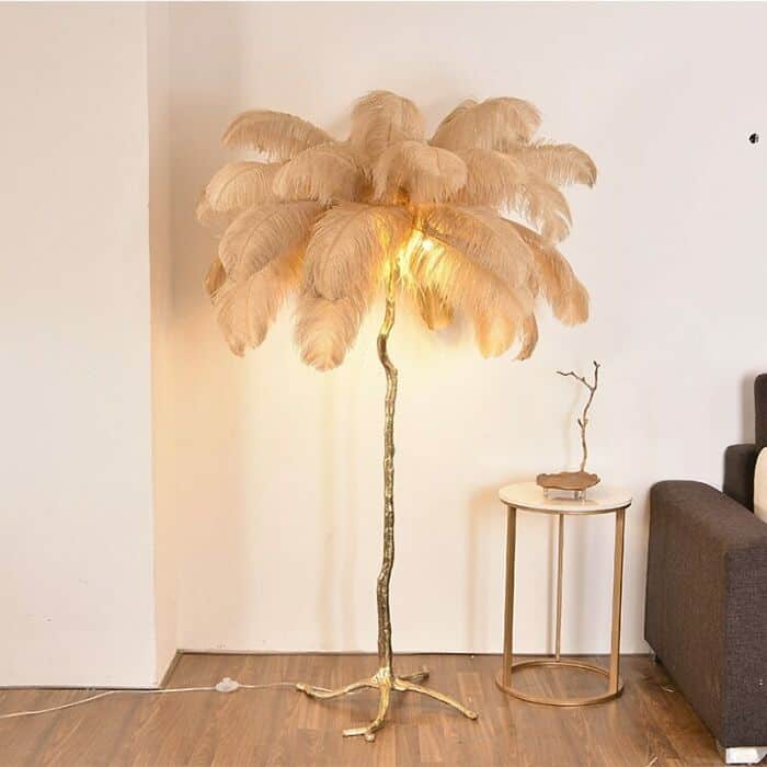 Unique feather lamp with a tall, curved stand in a modern living room setting.