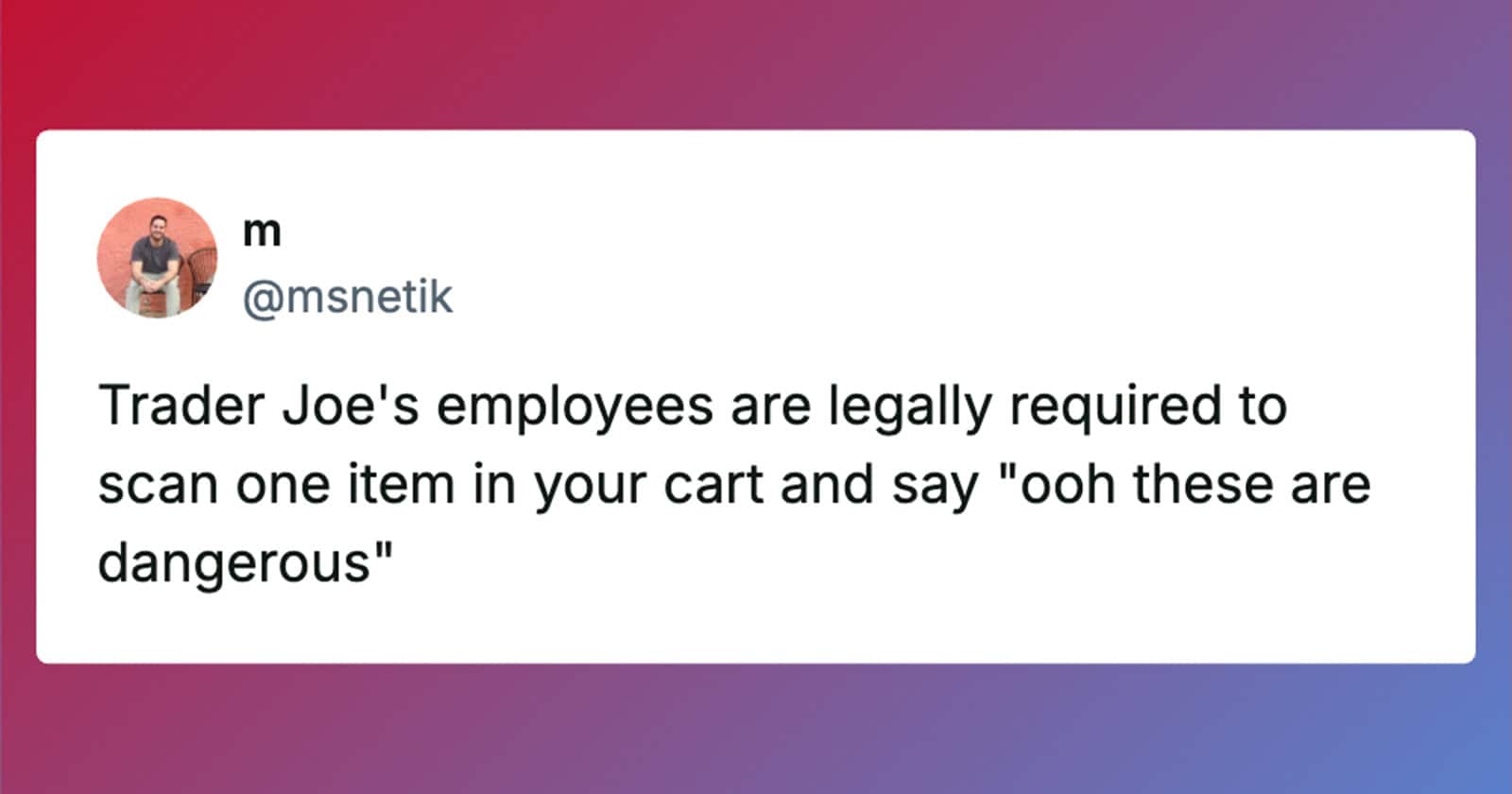 Trader Joe's employee scanning a customer's item at checkout.