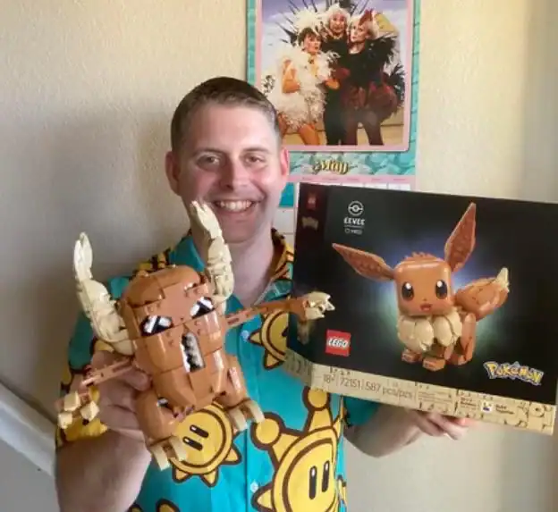LEGO Eevee and Pikachu Pokémon figures with a smiling man holding a box.