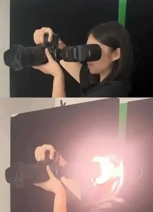 A woman with black hair holding a professional camera, taking a photo.