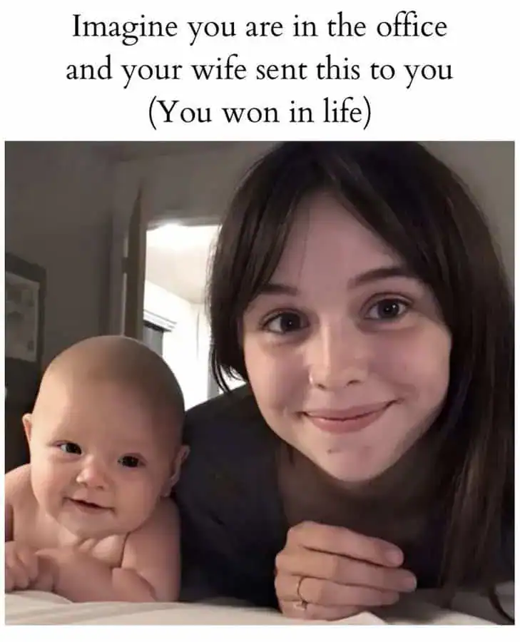 Woman and baby smiling together, humorous office meme about winning in life.