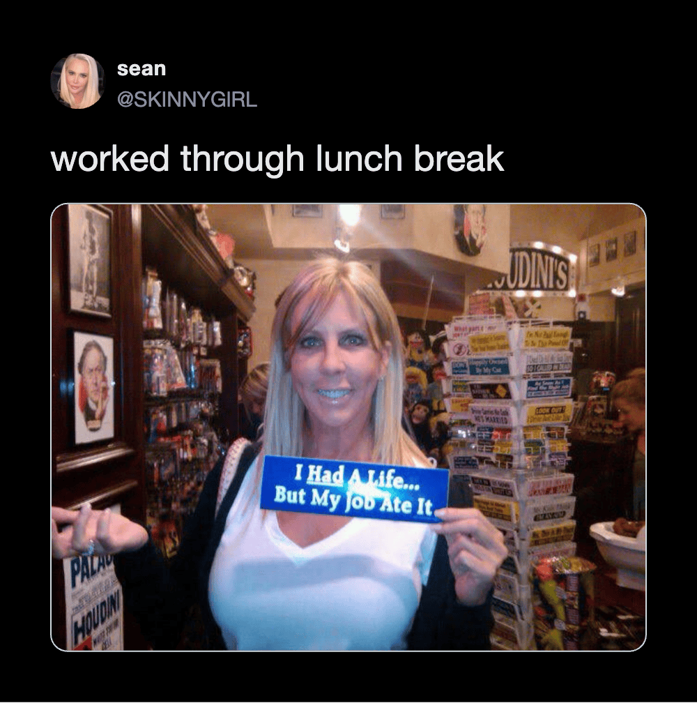 Funny woman holding a sign in a store during lunch break.