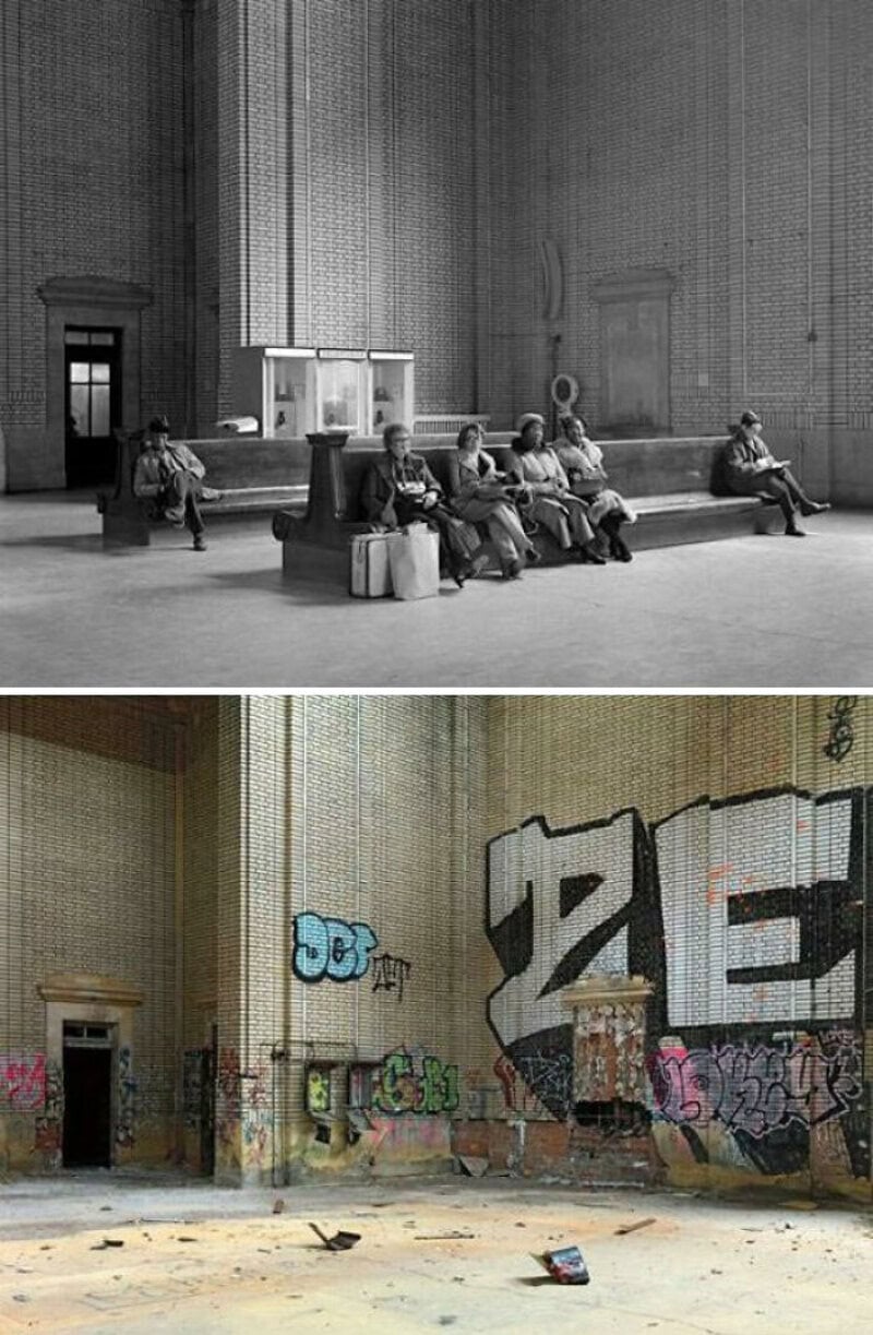People sitting on benches in a large, empty hall with high ceilings and tall curtains.