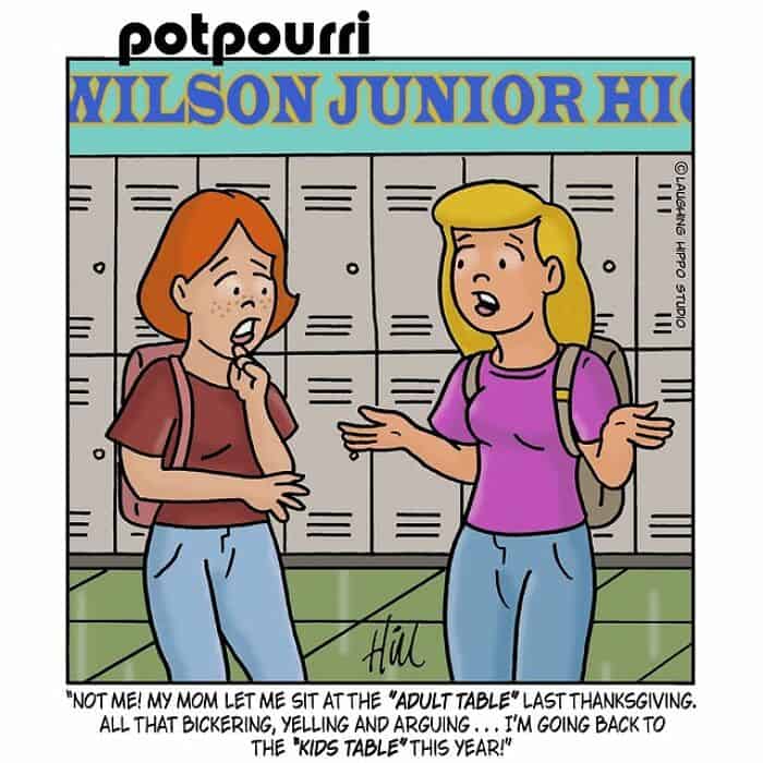 Two teenage girls having a conversation in front of school lockers.