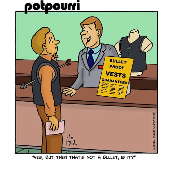 Bulletproof vests guaranteed sign at a store counter with a man trying on a vest and a clerk explain.