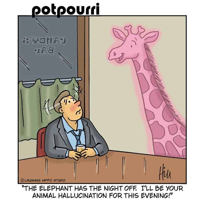 A woman sitting at a table with a glass, looking up at a pink giraffe on the wall.