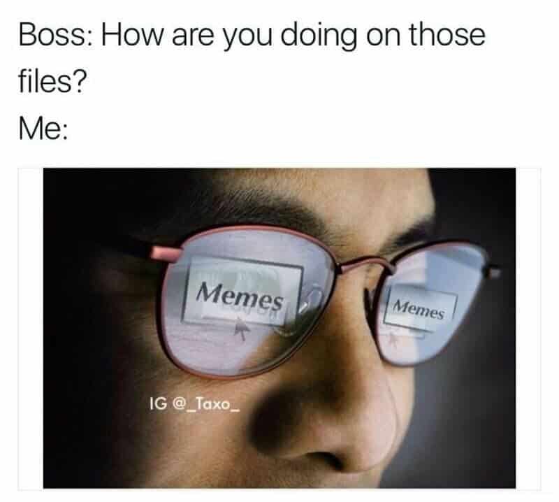 Person wearing glasses with 'Memes' reflected in the lenses.
