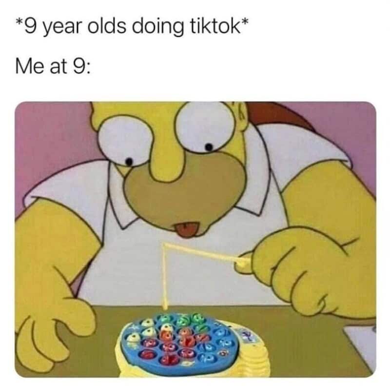 9 year olds doing TikTok, Homer Simpson playing with a toy, childhood nostalgia.