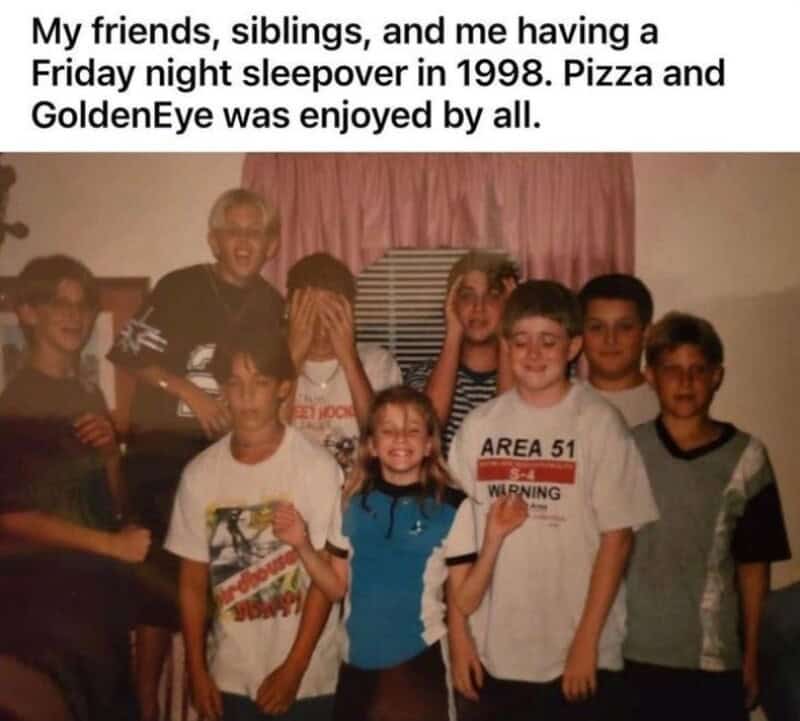 Group of children and an adult at a sleepover in 1998, with pizza and GoldenEye game.