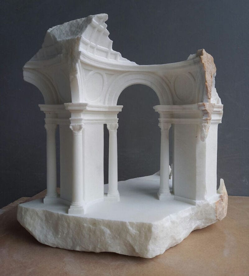 Ancient marble architectural fragment with columns and arches from classical sculpture.