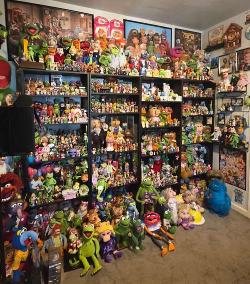 Collection of plush toys and figurines from various shows and characters on shelves.