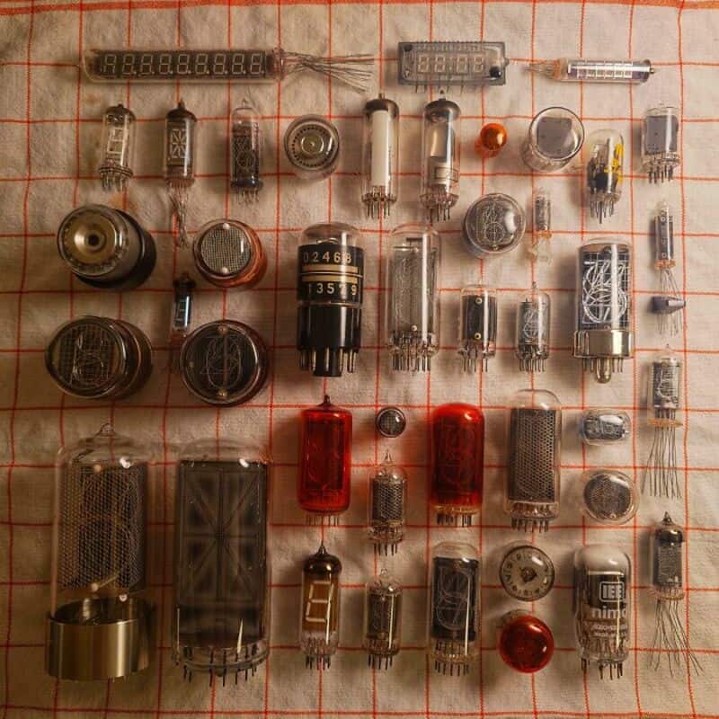 Collection of vintage electronic components including vacuum tubes and resistors.