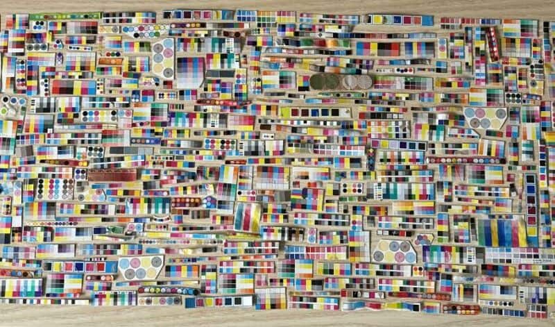 Colorful collection of domino tiles arranged on a surface.