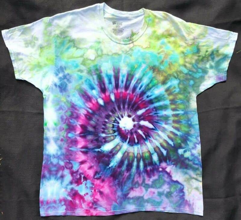Vibrant tie-dye spiral T-shirt with bright colors and abstract pattern.