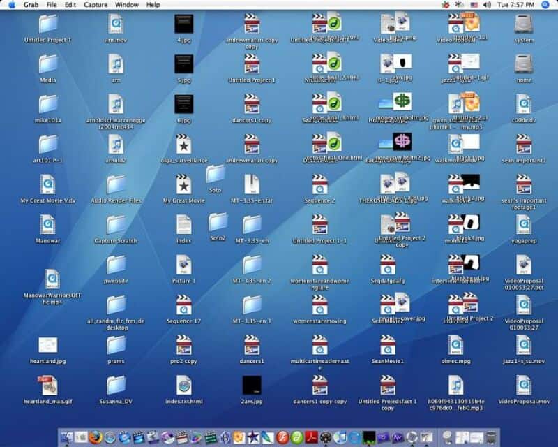 Desktop with numerous files, folders, and icons scattered across the screen.