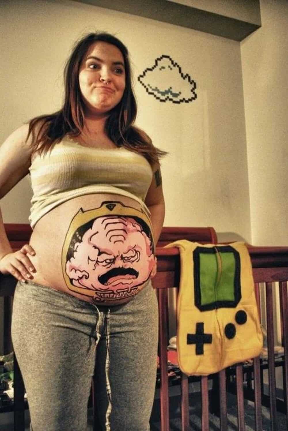 Pregnant woman with a painted belly and pixelated cloud above her head.