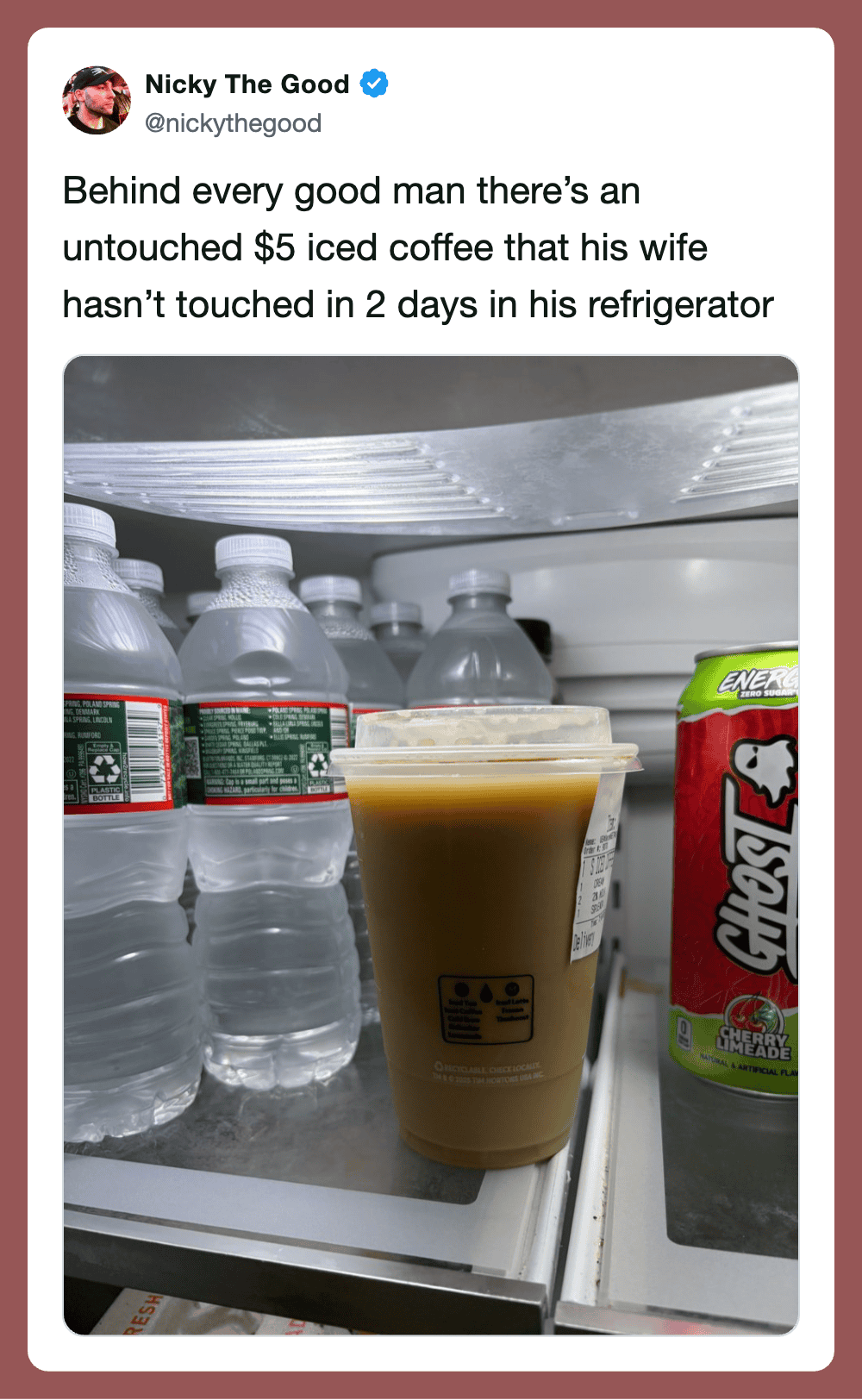 A $5 iced coffee in a refrigerator with bottled water and a juice box.
