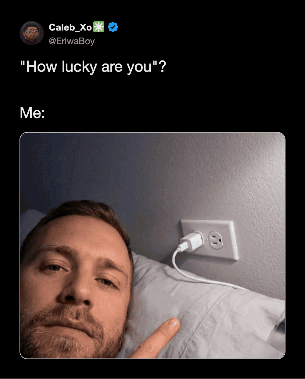 "How lucky are you"? Me: Pointing at an electrical outlet with a charger plugged in, lying in bed.