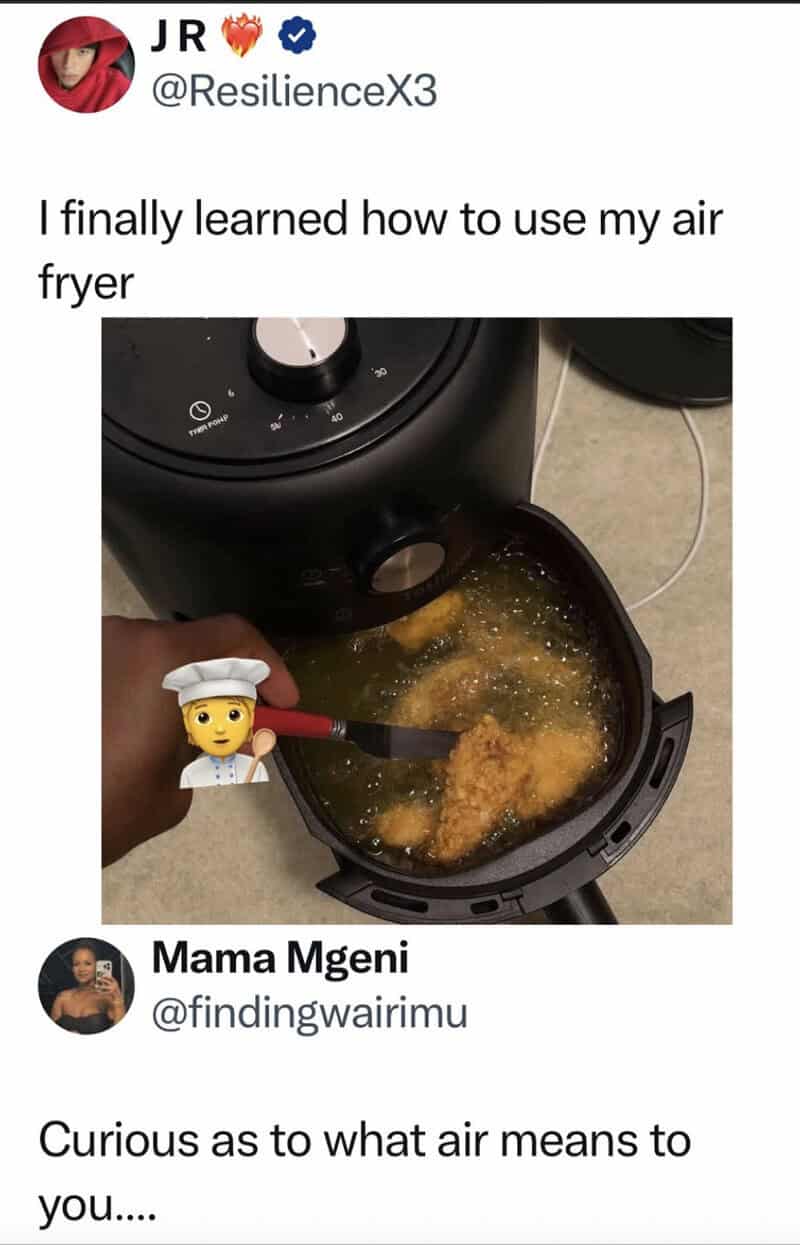 Air fryer cooking with a person using a spatula, oil bubbling in the basket.
