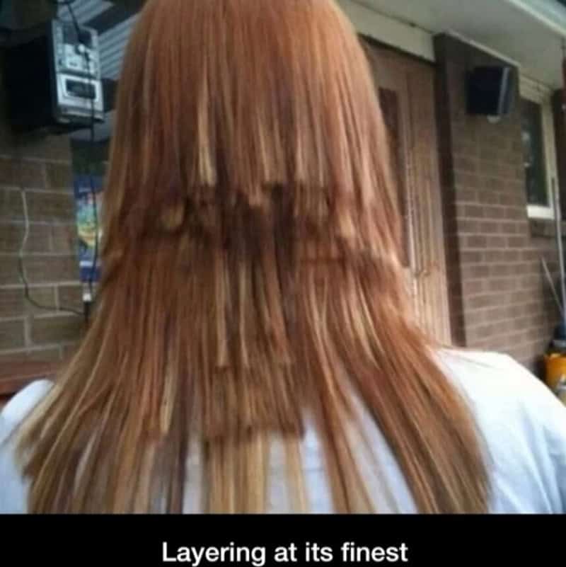 Haircut fails with uneven layering and choppy ends on reddish hair.