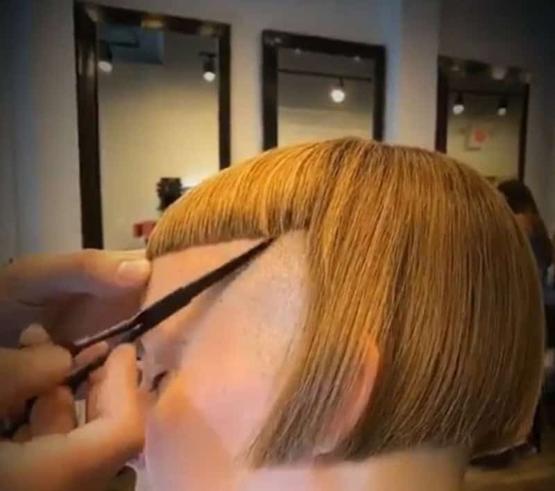 Haircut fail with uneven fringe and sharp cut lines.