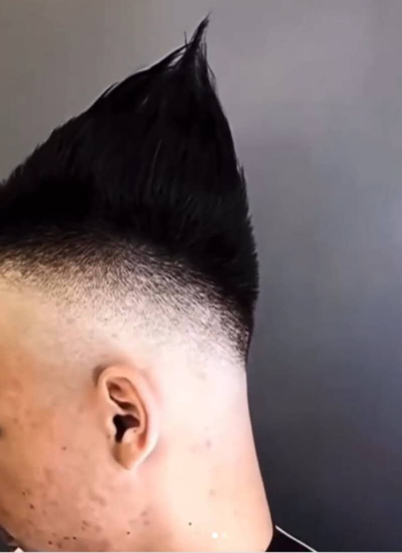 Haircut fails with a spiked mohawk and uneven fade.