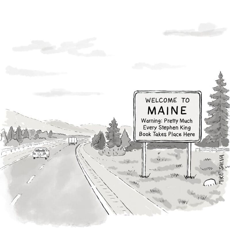Welcome to Maine sign with humorous warning about Stephen King books.