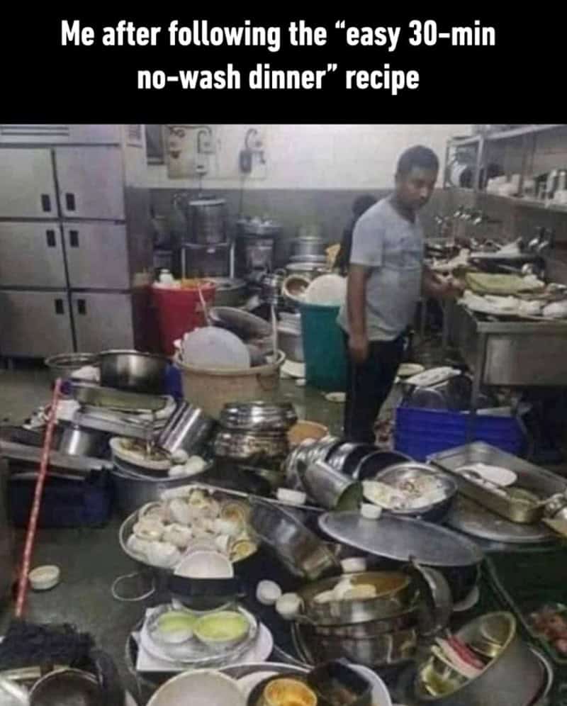 Overwhelmed kitchen with dishes and cookware scattered, man standing amidst chaos after quick dinner.