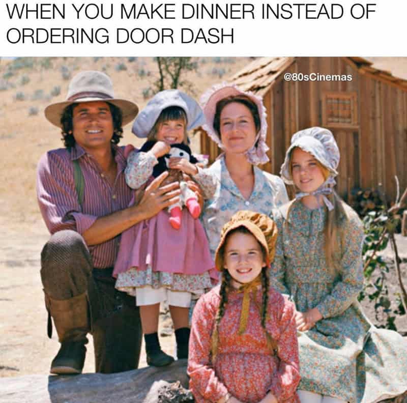 Family in vintage clothing outdoors with a wooden house, caption about dinner instead of door dash.