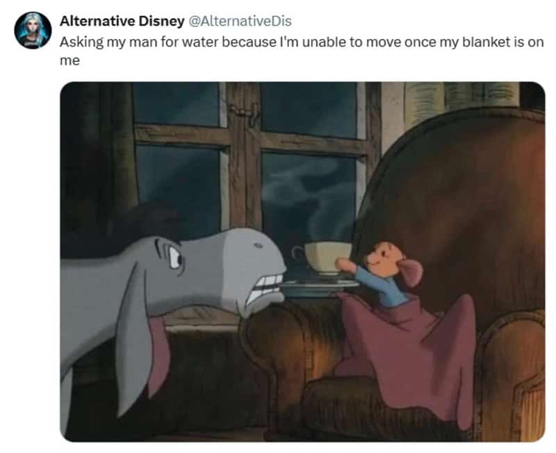 Minnie Mouse offering water to a large elephant in a cozy room.