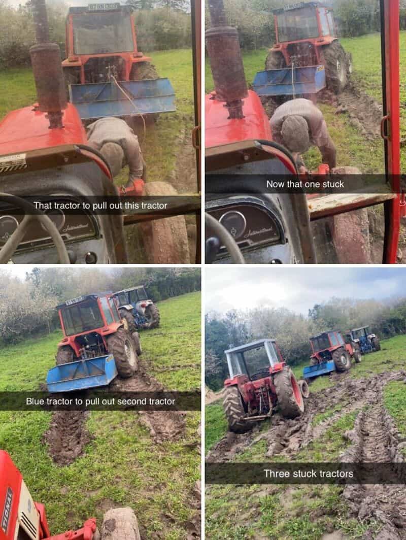 Tractors stuck in muddy field with a person trying to free them.
