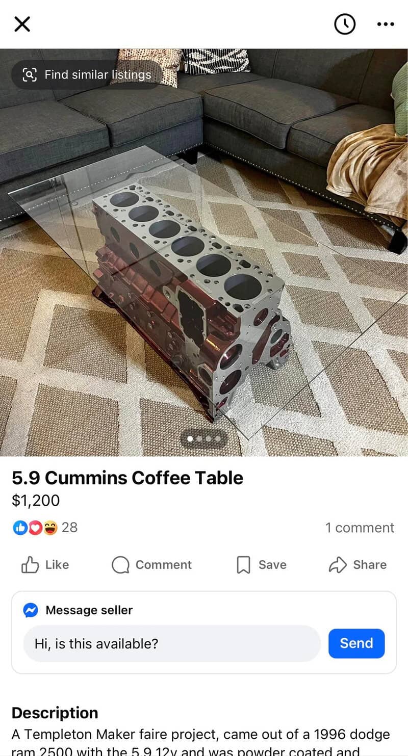 Coffee table made from a 1996 Dodge Ram engine block with a glass top.