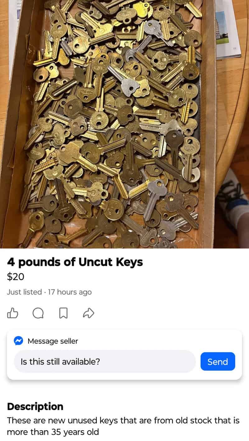 A box filled with 4 pounds of uncut, unused keys, mostly brass and silver.