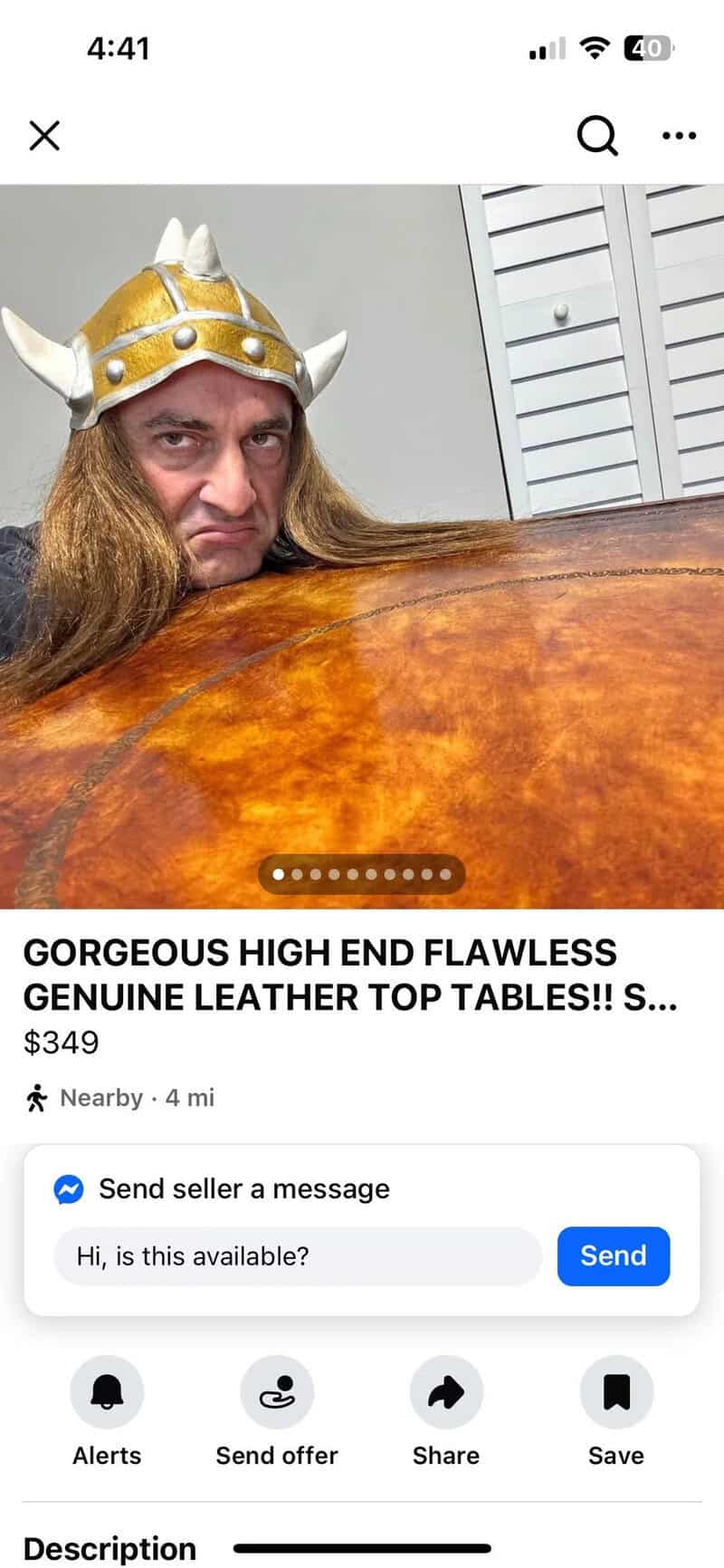 Person with long hair wearing a Viking helmet peeking over a leather top.