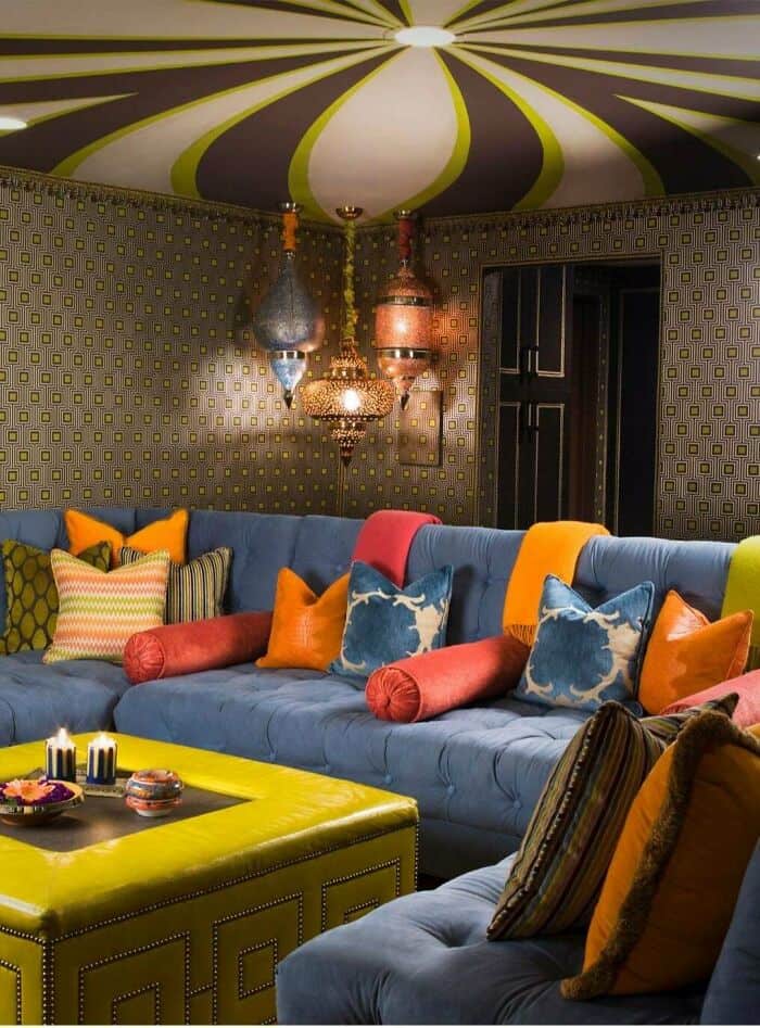 Bright, colorful living room with patterned walls, vibrant cushions, and hanging lanterns creating a.