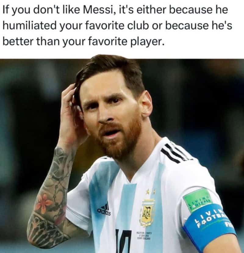 Lionel Messi in Argentina jersey with a puzzled expression, hand on head.