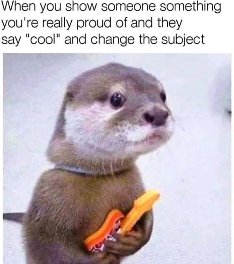 Cute otter holding a toy guitar with text about showing pride and changing the subject.