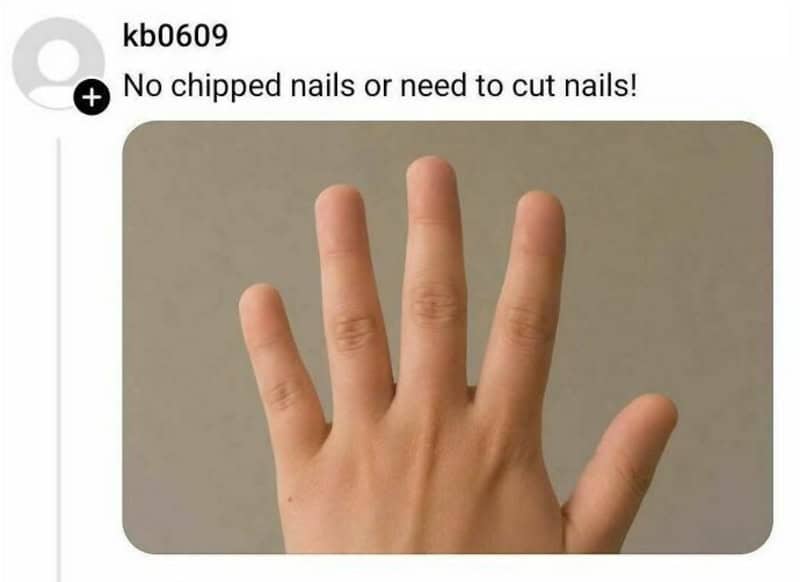 Hand with four fingers extended, no chipped or cut nails.