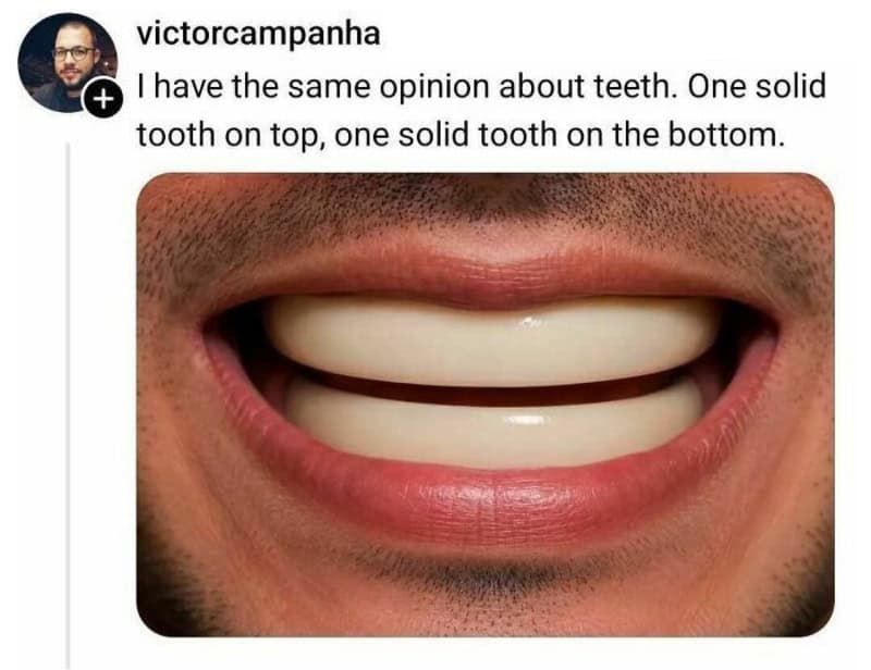 Close-up of a person's mouth showing two solid teeth, one on top and one on the bottom.