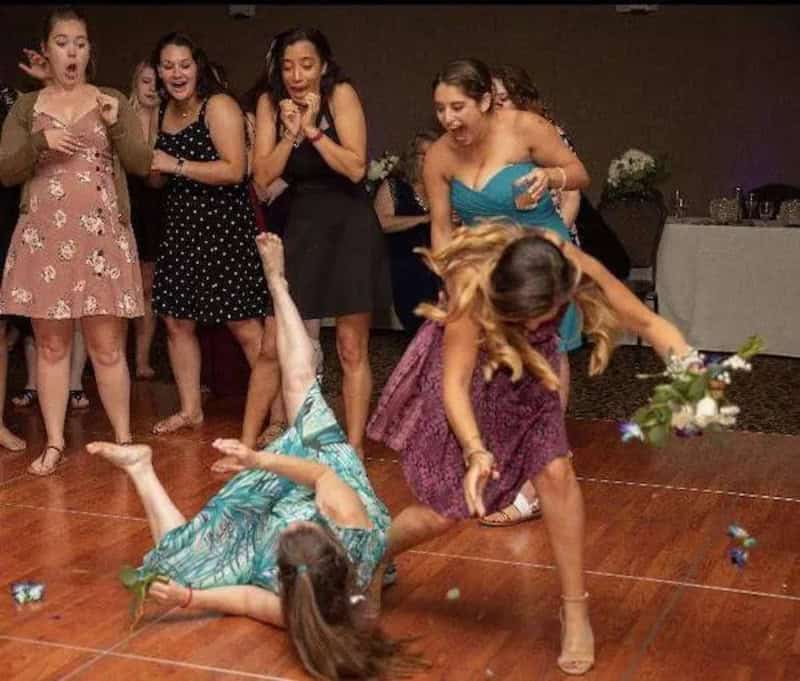 Girls dancing and having fun at a party, some are surprised and others are laughing.