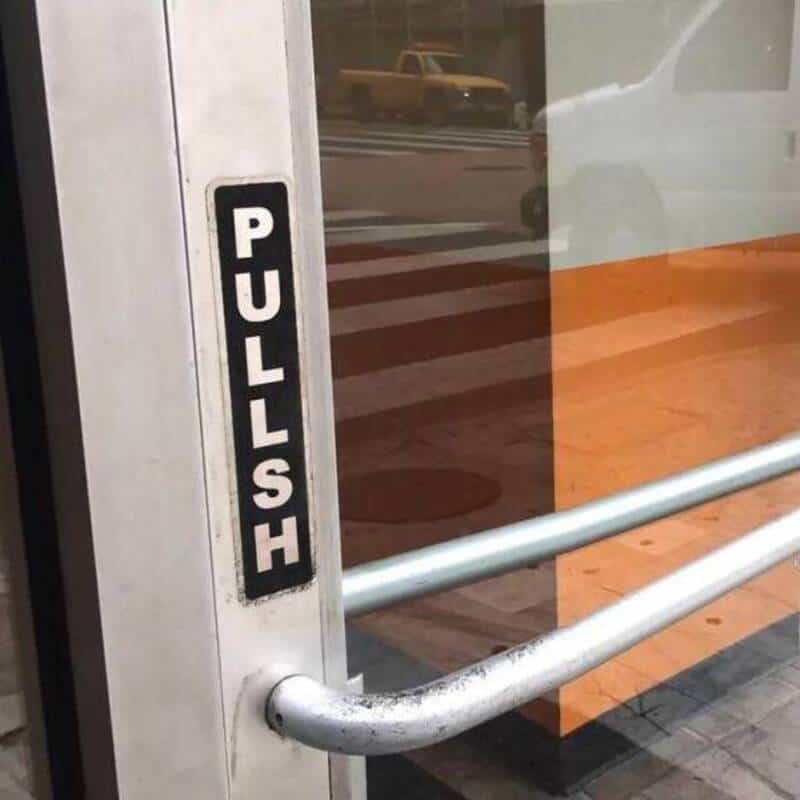 Pull door handle with "PULL" sign on the door.
